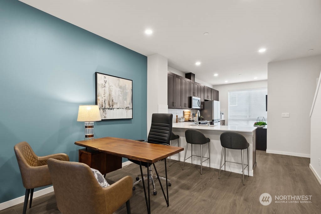 23413 Edmonds Way, Unit E4 Edmonds, WA 98026 - Photo 4 of 22 a view of a dining room with furniture and wooden floor