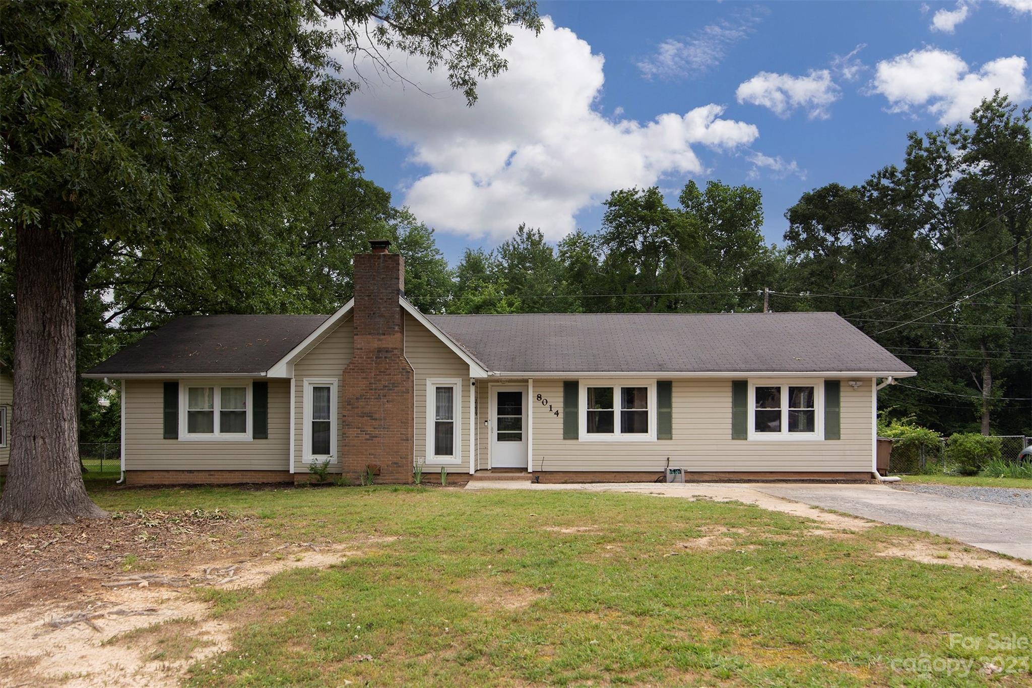 8014 Red Lantern Road Indian Trail, NC 28079 - Photo 1 of 24 a front view of a house with a garden