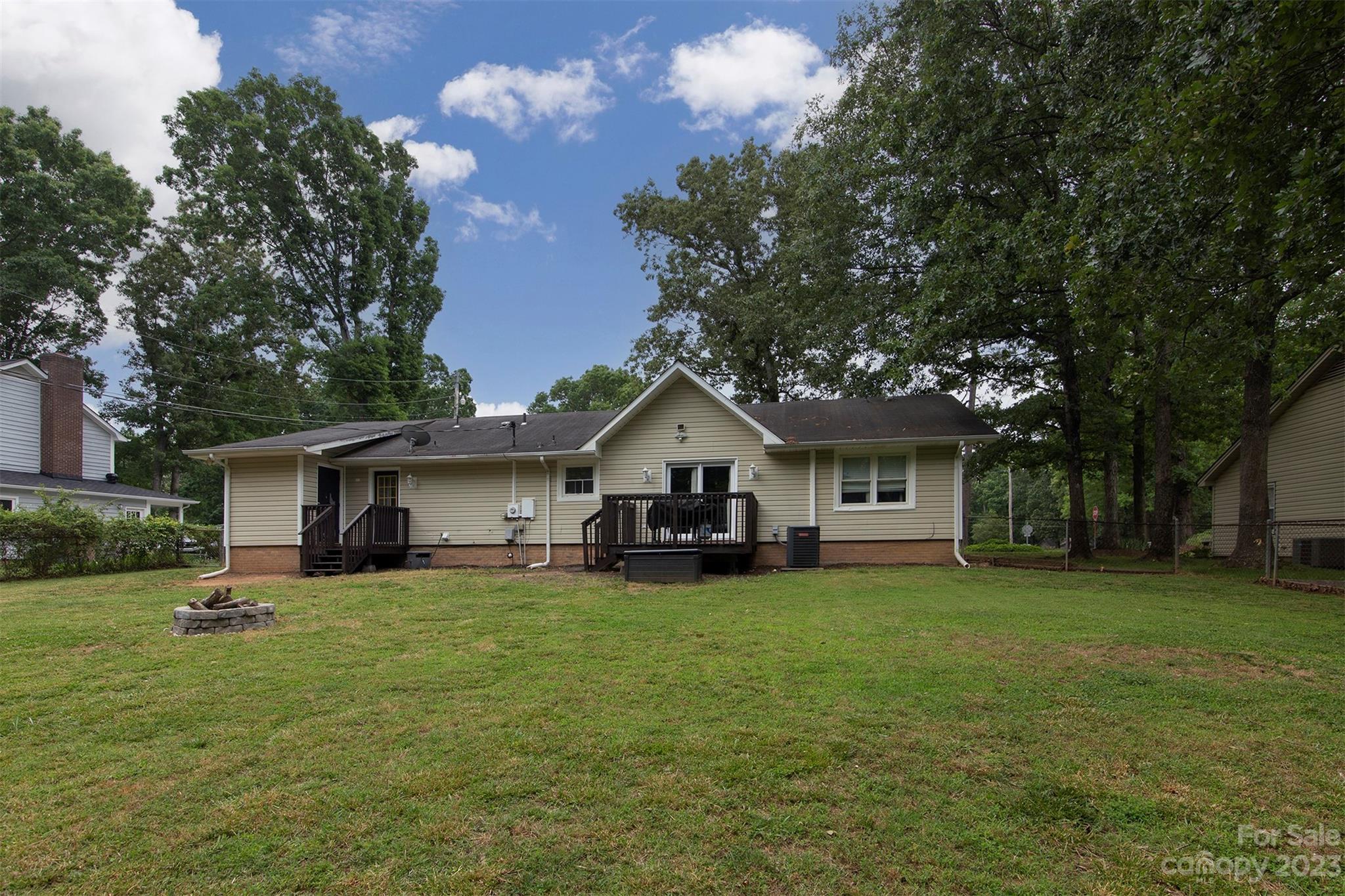 8014 Red Lantern Road Indian Trail, NC 28079 - Photo 22 of 24 a front view of a house with a yard and trees