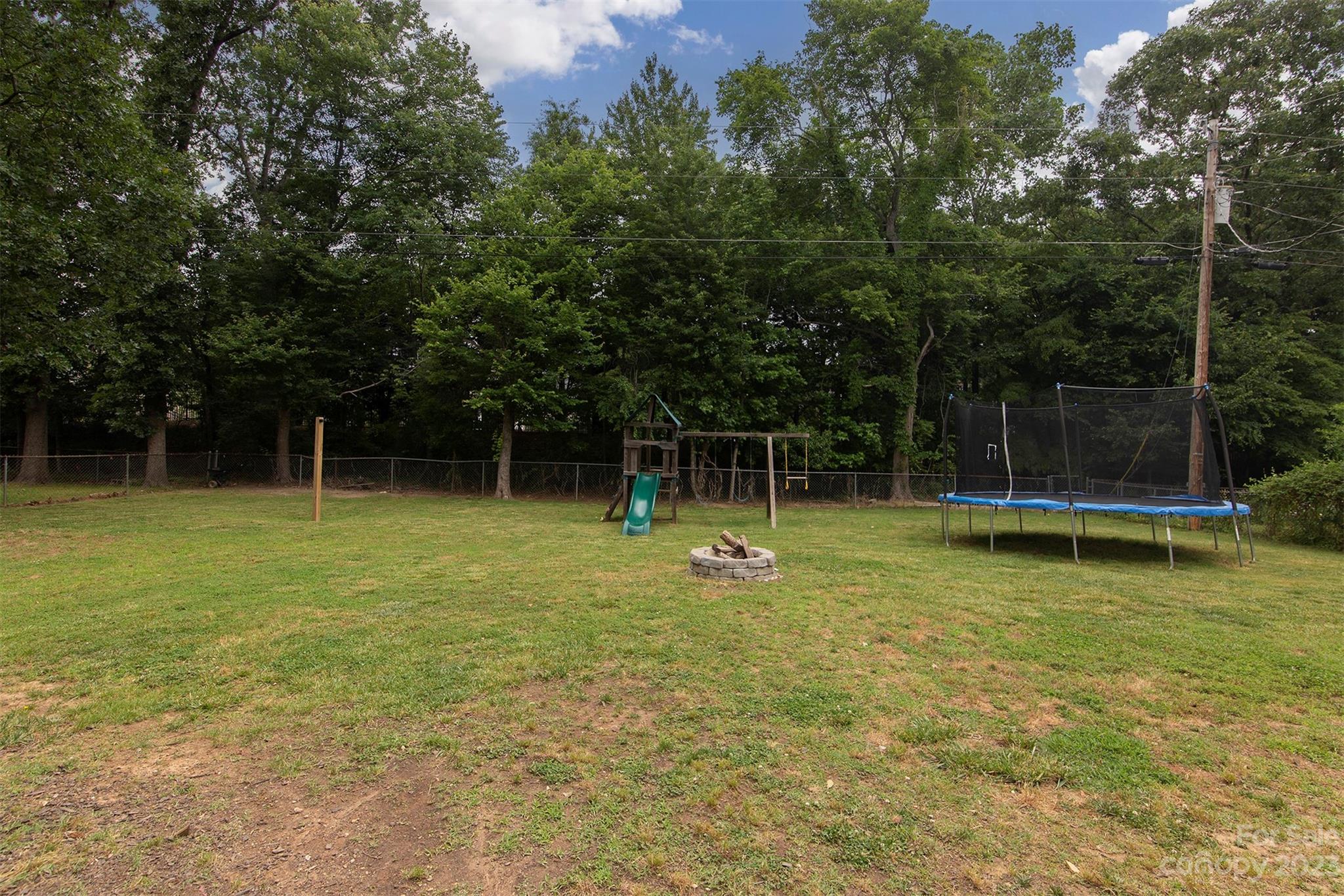 8014 Red Lantern Road Indian Trail, NC 28079 - Photo 24 of 24 a view of a house with a backyard and a swimming pool