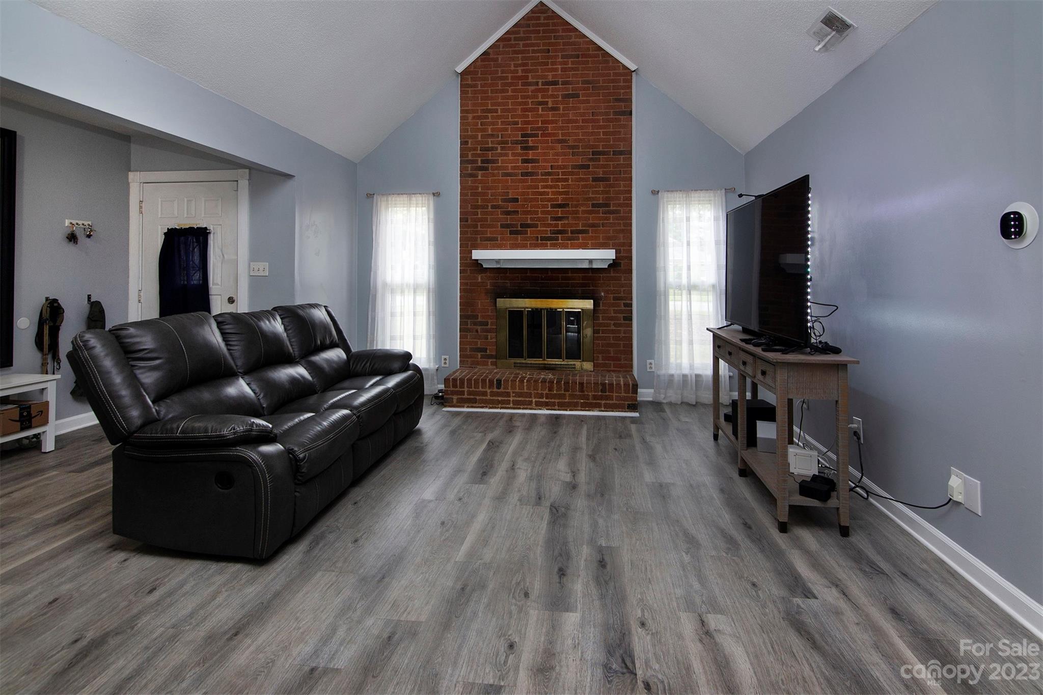 8014 Red Lantern Road Indian Trail, NC 28079 - Photo 4 of 24 a living room with furniture and a fireplace