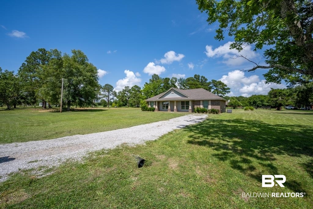 15874 Carver Road, Unit C Foley, AL 36535 - Photo 2 of 18 Single story home with a front yard