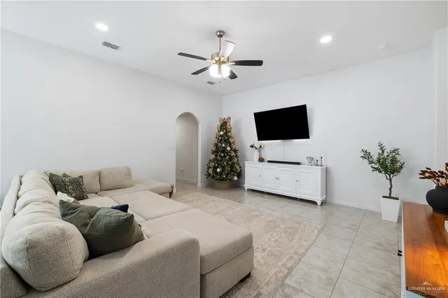 a kitchen with granite countertop a sink white cabinets and stainless steel appliances