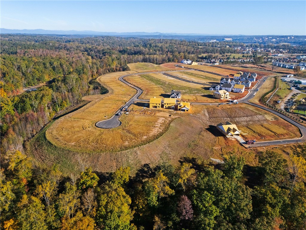 555 Hydrangea Street, Unit LOT 47 Seneca, SC 29678 - Photo 40 of 42 Rolling hills and mature trees frame this burgeoning community, offering scenic views and abundant natural beauty.