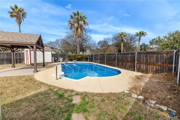 a view of a house with swimming pool