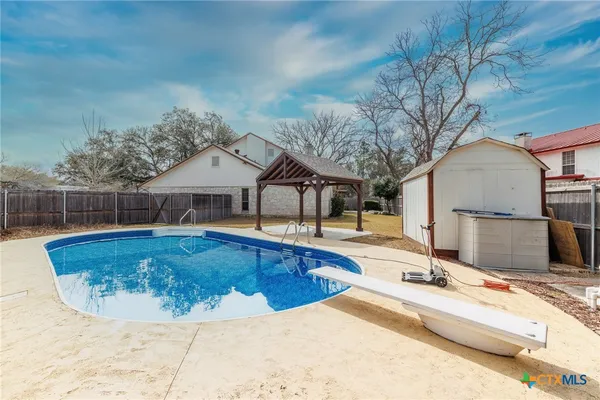 a view of a house with swimming pool