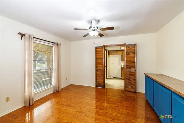 a view of an empty room with a window
