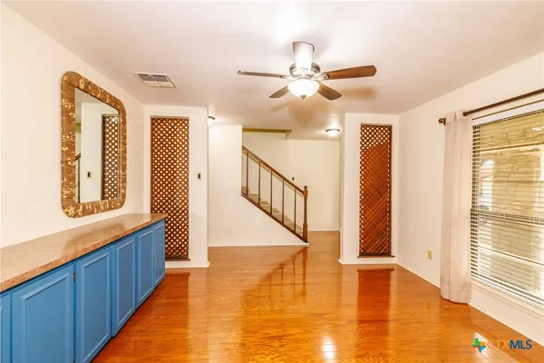 a view of an entryway with wooden floor