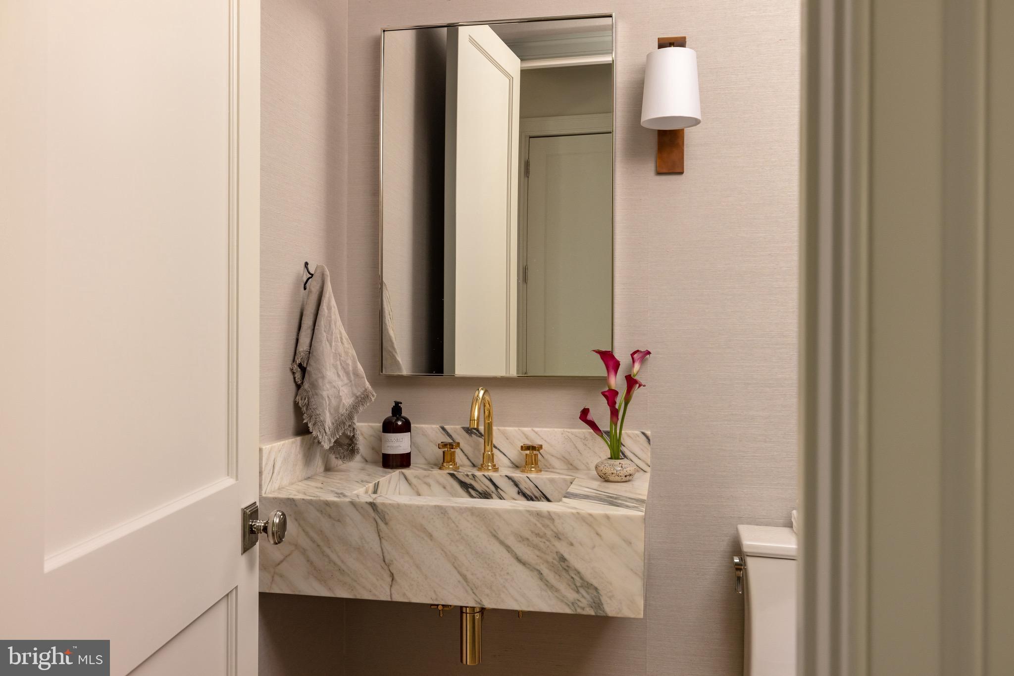 2934 Ellicott Terrace Northwest Washington, DC 20008 - Photo 14 of 55 a bathroom with a sink and a mirror
