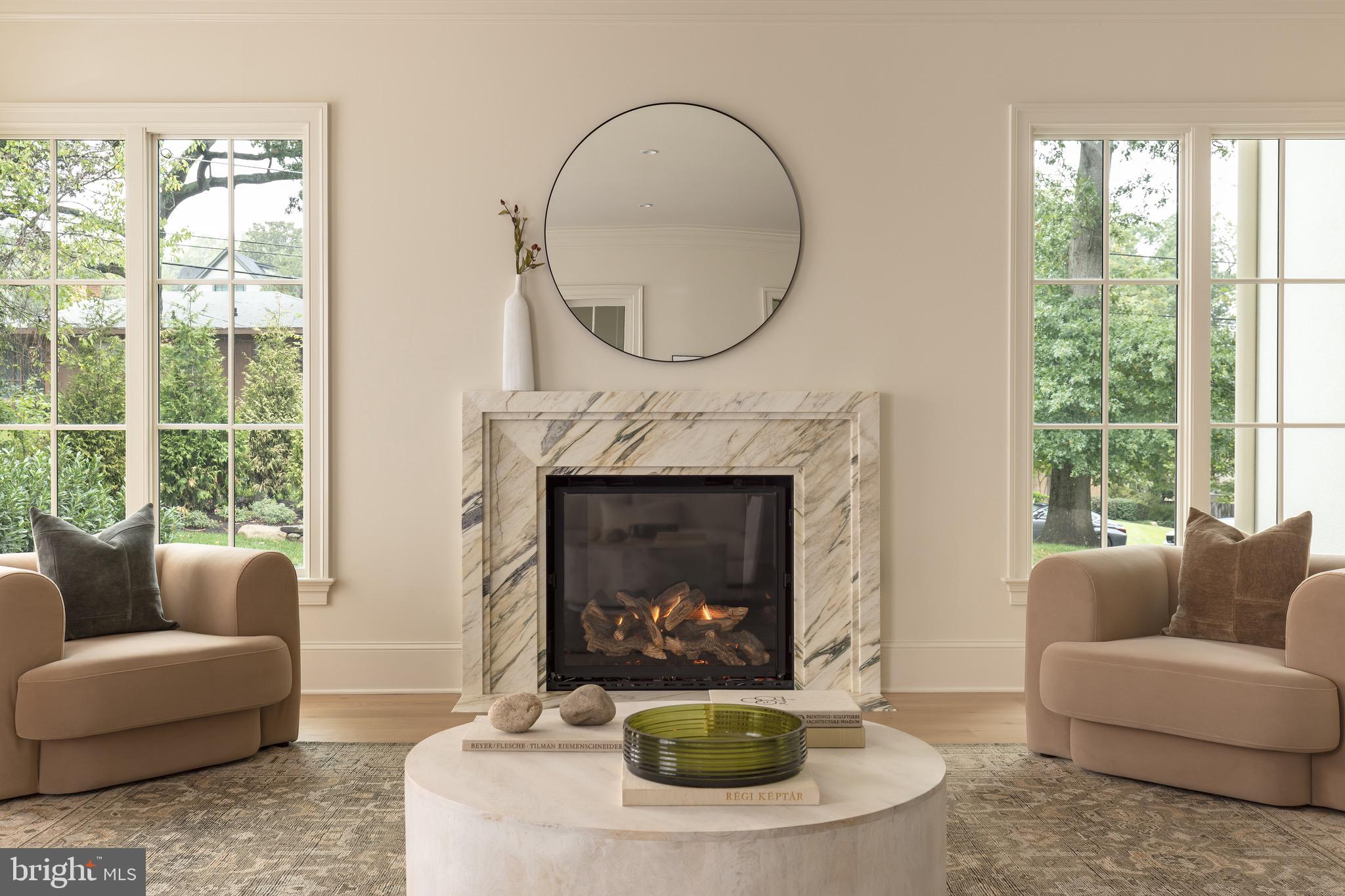 2934 Ellicott Terrace Northwest Washington, DC 20008 - Photo 16 of 55 a living room with furniture a fireplace and a large window