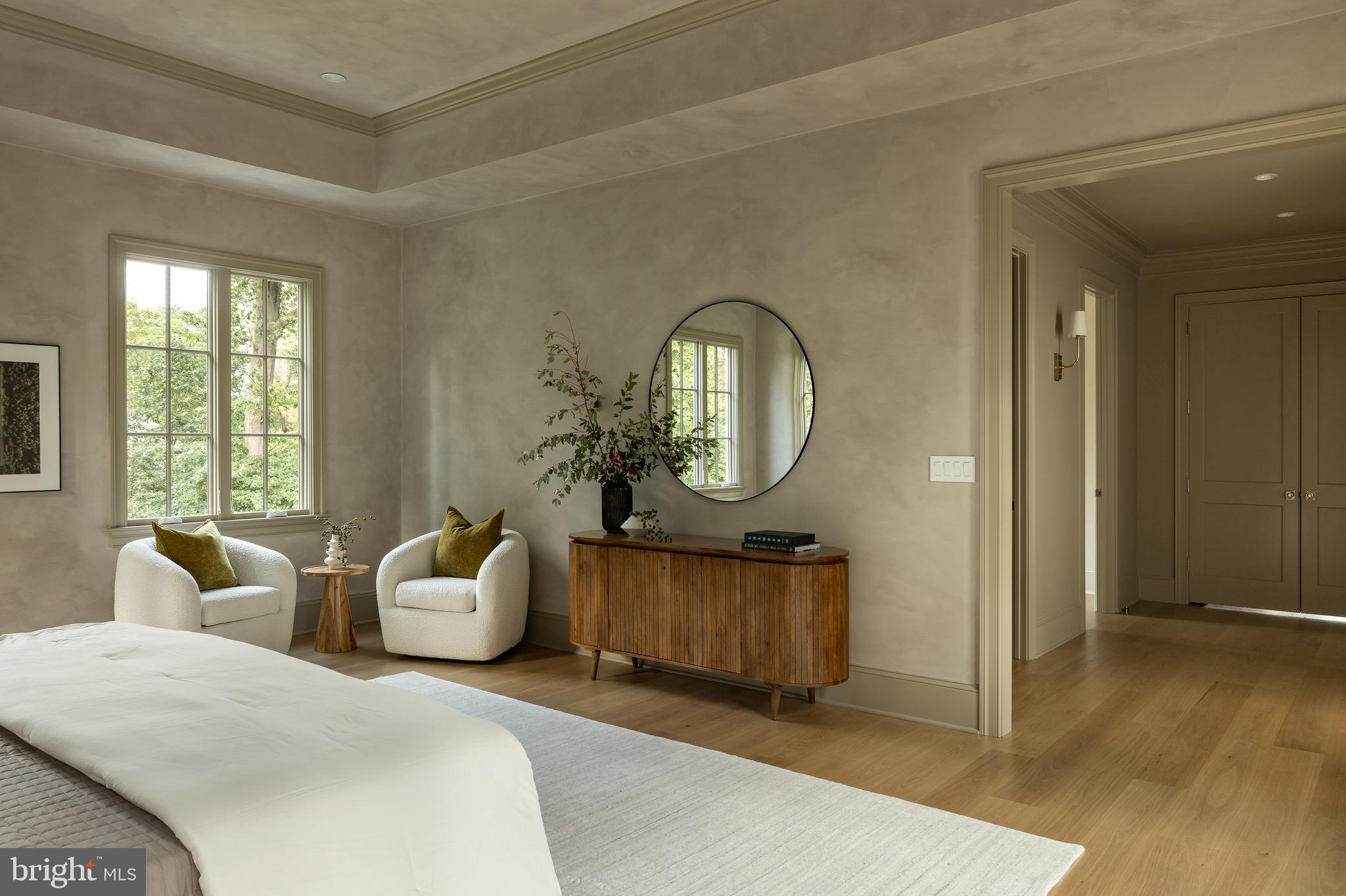 2934 Ellicott Terrace Northwest Washington, DC 20008 - Photo 23 of 55 a living room with furniture a mirror and a large window