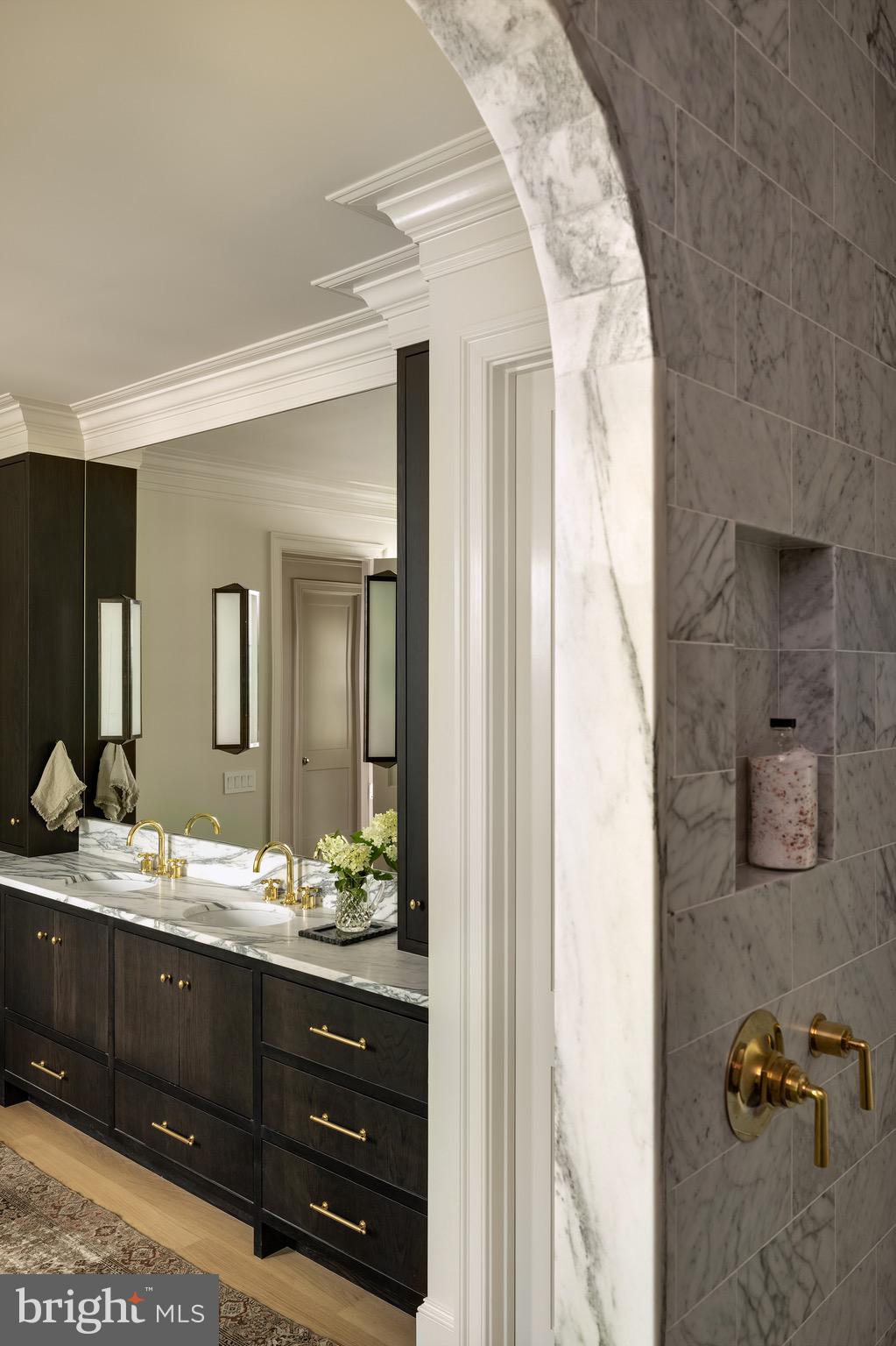 2934 Ellicott Terrace Northwest Washington, DC 20008 - Photo 27 of 55 a bathroom with a double vanity sink and a mirror