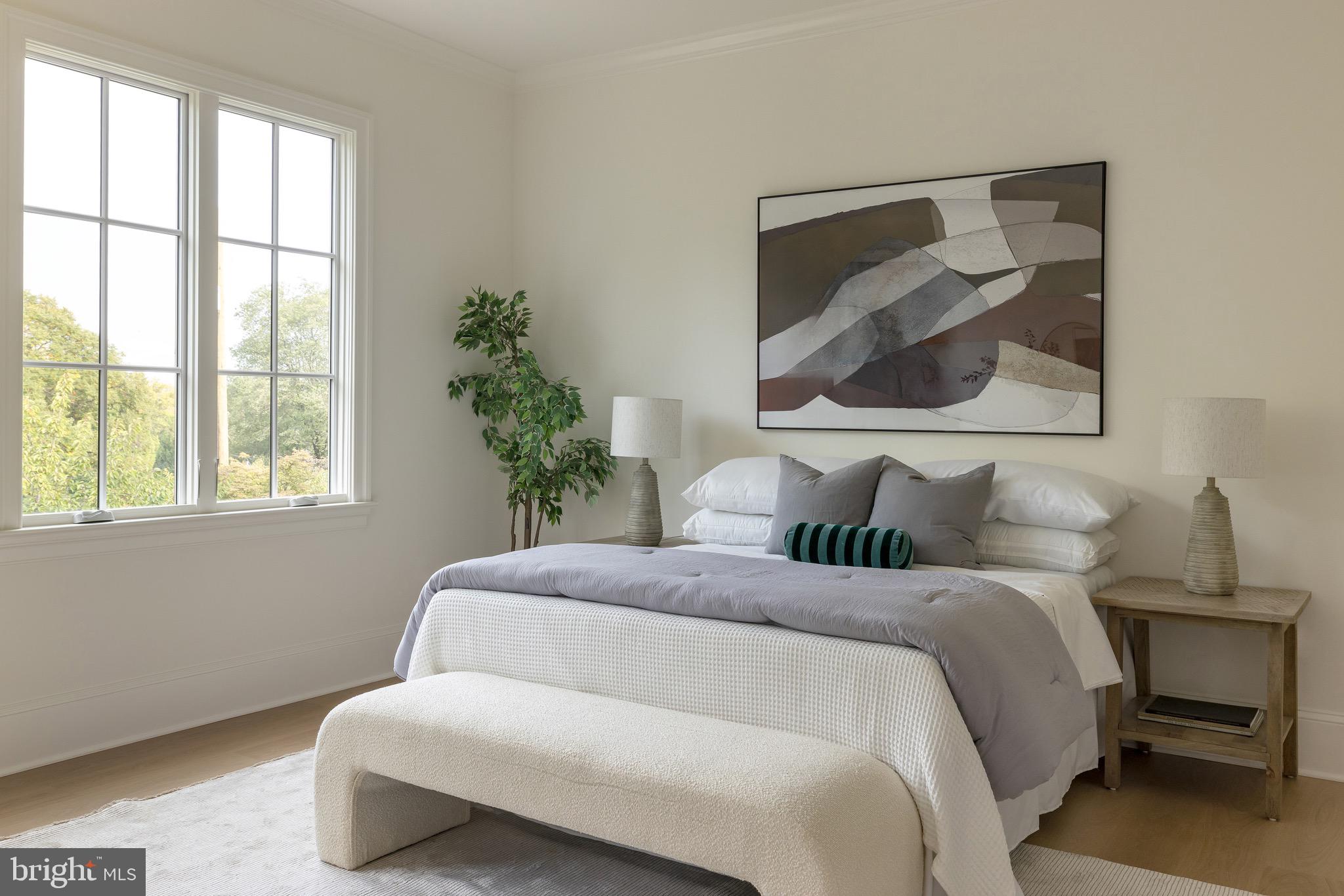 2934 Ellicott Terrace Northwest Washington, DC 20008 - Photo 29 of 55 a bedroom with a bed and a painting on the wall