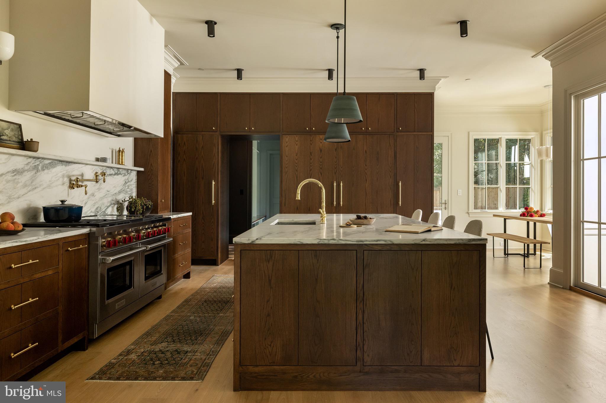 2934 Ellicott Terrace Northwest Washington, DC 20008 - Photo 3 of 55 a kitchen with a sink and stove