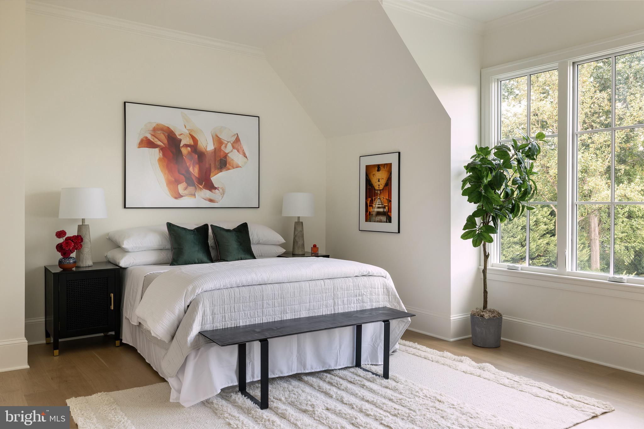 2934 Ellicott Terrace Northwest Washington, DC 20008 - Photo 32 of 55 a bed sitting in a bedroom next to a window