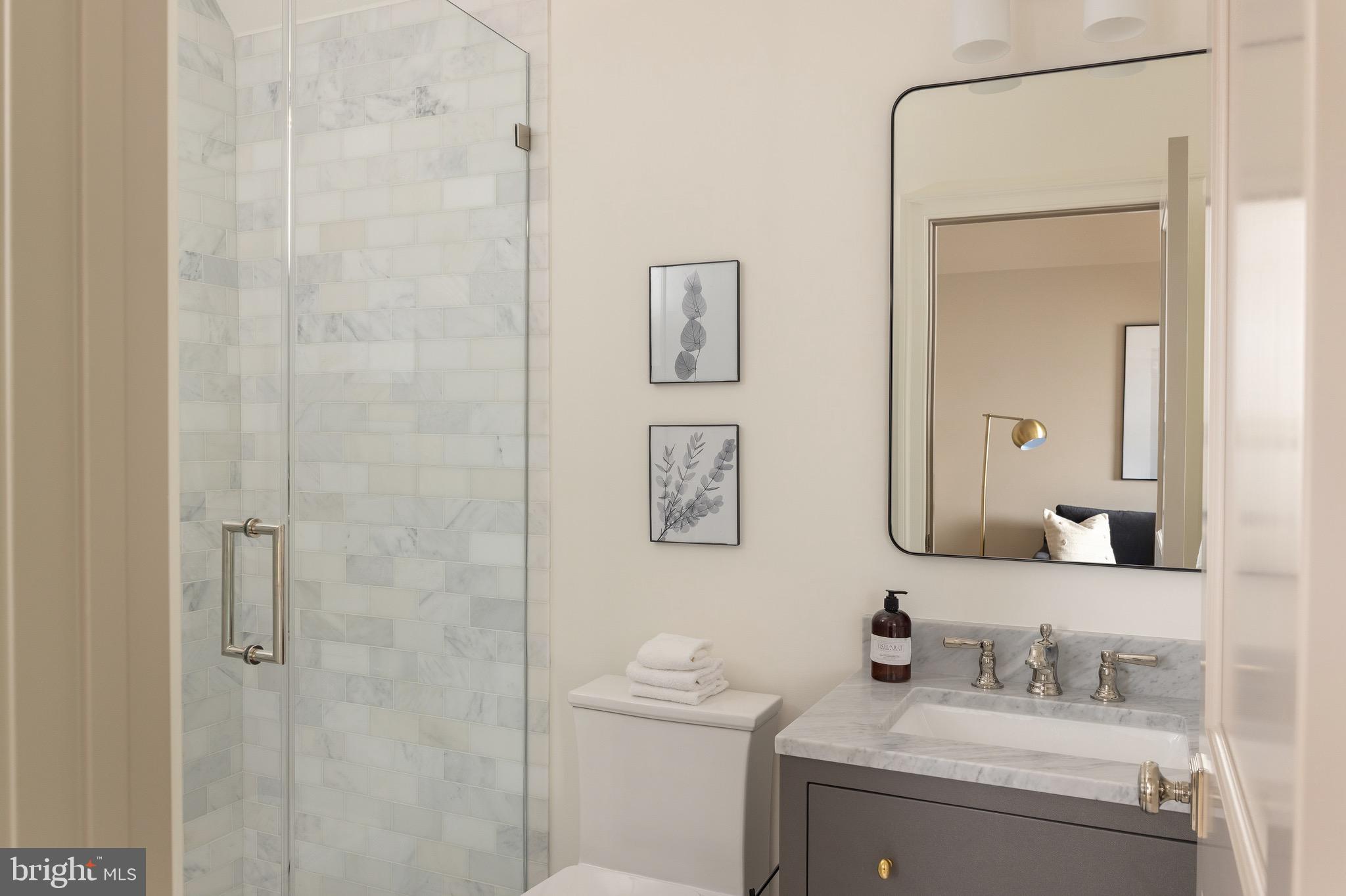 2934 Ellicott Terrace Northwest Washington, DC 20008 - Photo 39 of 55 a bathroom with a sink vanity and a mirror