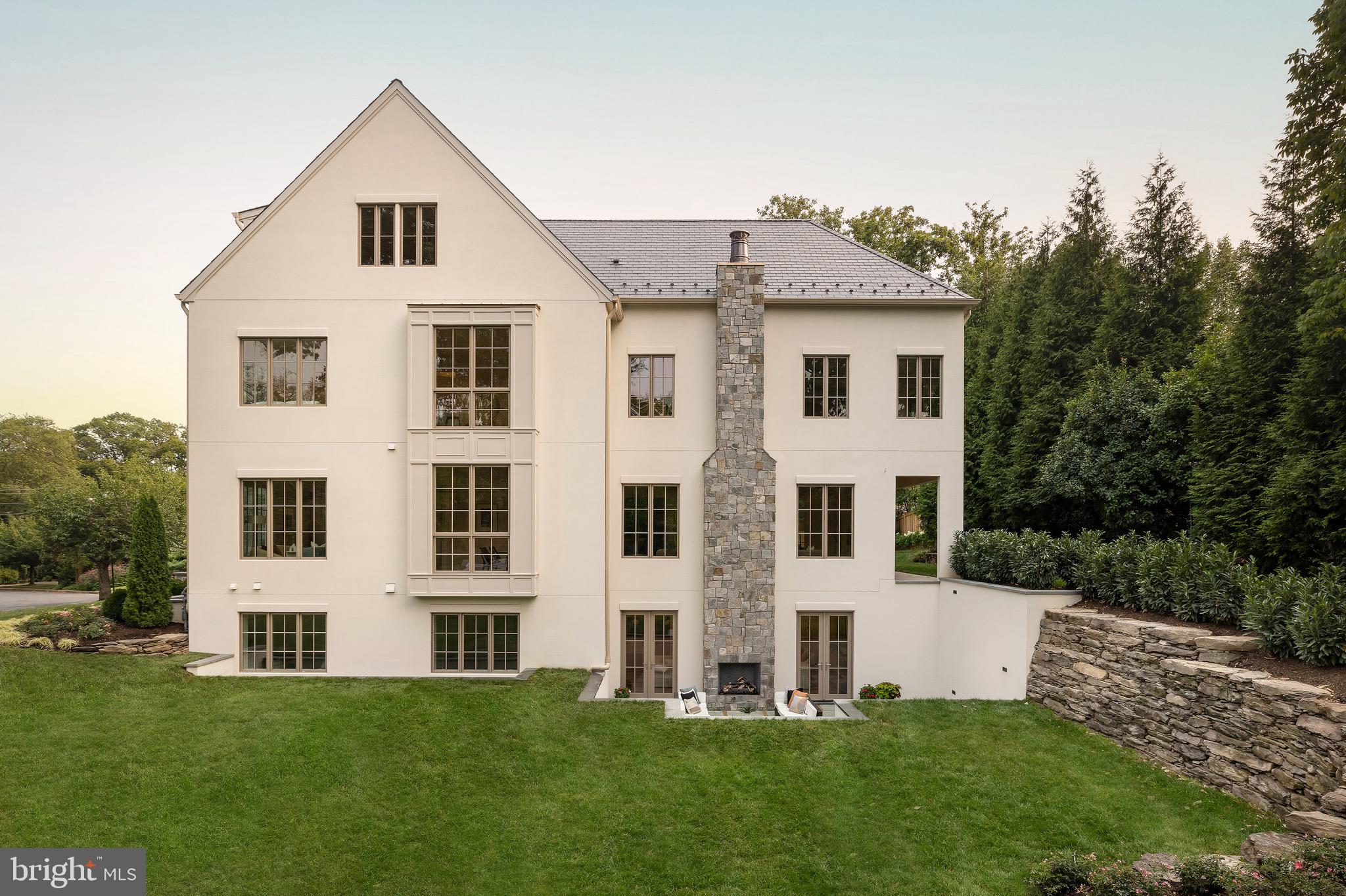 2934 Ellicott Terrace Northwest Washington, DC 20008 - Photo 49 of 55 a front view of a house with a yard