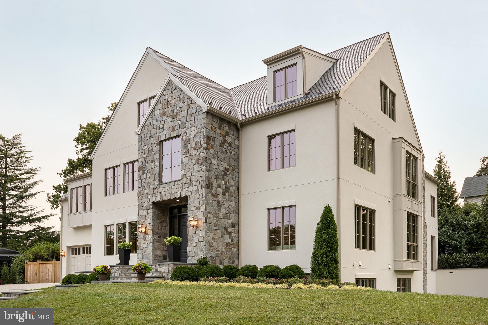 2934 Ellicott Terrace Northwest Washington, DC 20008 - Photo 51 of 55 a front view of a house with a yard
