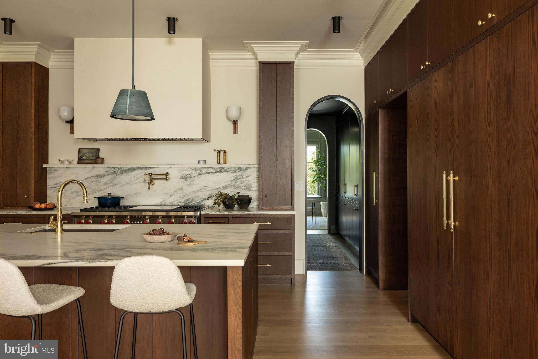 2934 Ellicott Terrace Northwest Washington, DC 20008 - Photo 9 of 55 a kitchen with stainless steel appliances granite countertop a stove a sink dishwasher and a refrigerator with wooden floor