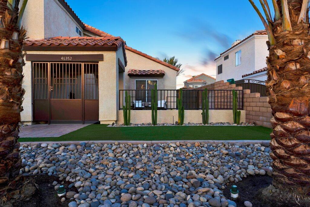 46352 Willow Lane Indio, CA 92201 - Photo 11 of 131 a front view of a house with garden