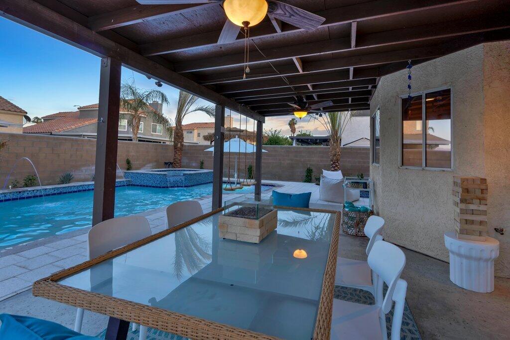 46352 Willow Lane Indio, CA 92201 - Photo 117 of 131 a view of a dining room with furniture wooden floor and a potted plant