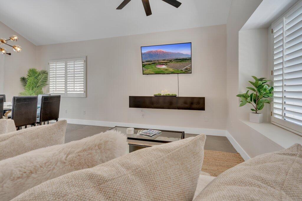 46352 Willow Lane Indio, CA 92201 - Photo 18 of 131 a living room with furniture and a flat screen tv