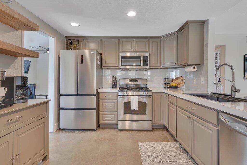 46352 Willow Lane Indio, CA 92201 - Photo 26 of 131 a kitchen with cabinets stainless steel appliances and a counter space