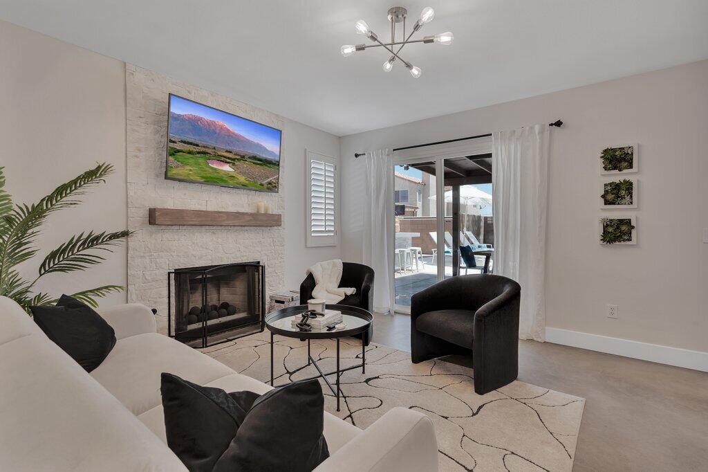 46352 Willow Lane Indio, CA 92201 - Photo 35 of 131 a living room with furniture and a fireplace