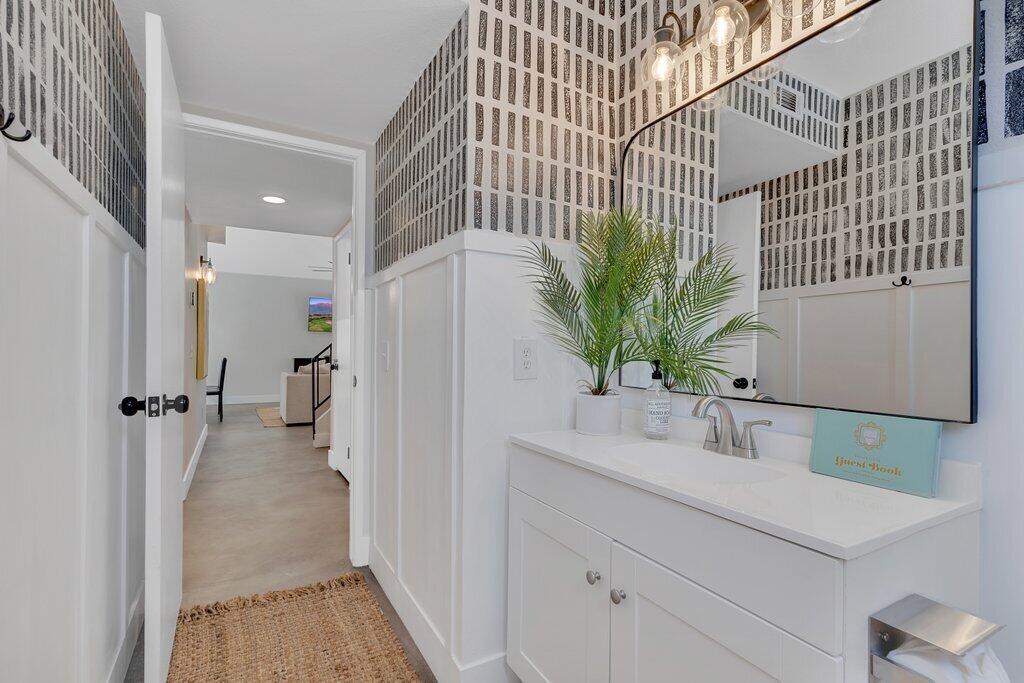 46352 Willow Lane Indio, CA 92201 - Photo 39 of 131 a bathroom with a sink a mirror and a shower