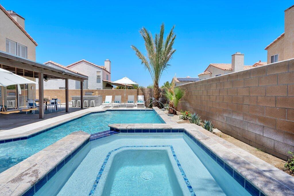 46352 Willow Lane Indio, CA 92201 - Photo 79 of 131 a view of a swimming pool with a lounge chairs