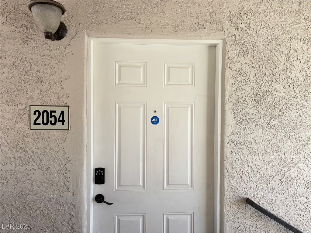 7300 West Pirates Cove Road, Unit 2054 Las Vegas, NV 89145 - Photo 13 of 16 Detailed view of stucco siding