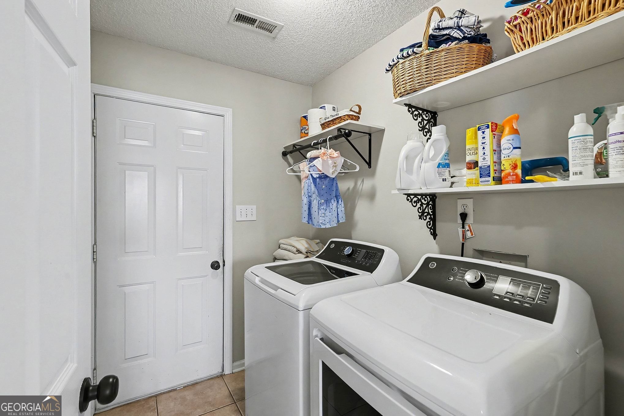 143 Pheasant Ridge Newnan, GA 30265 - Photo 14 of 27 a utility room with dryer and washer