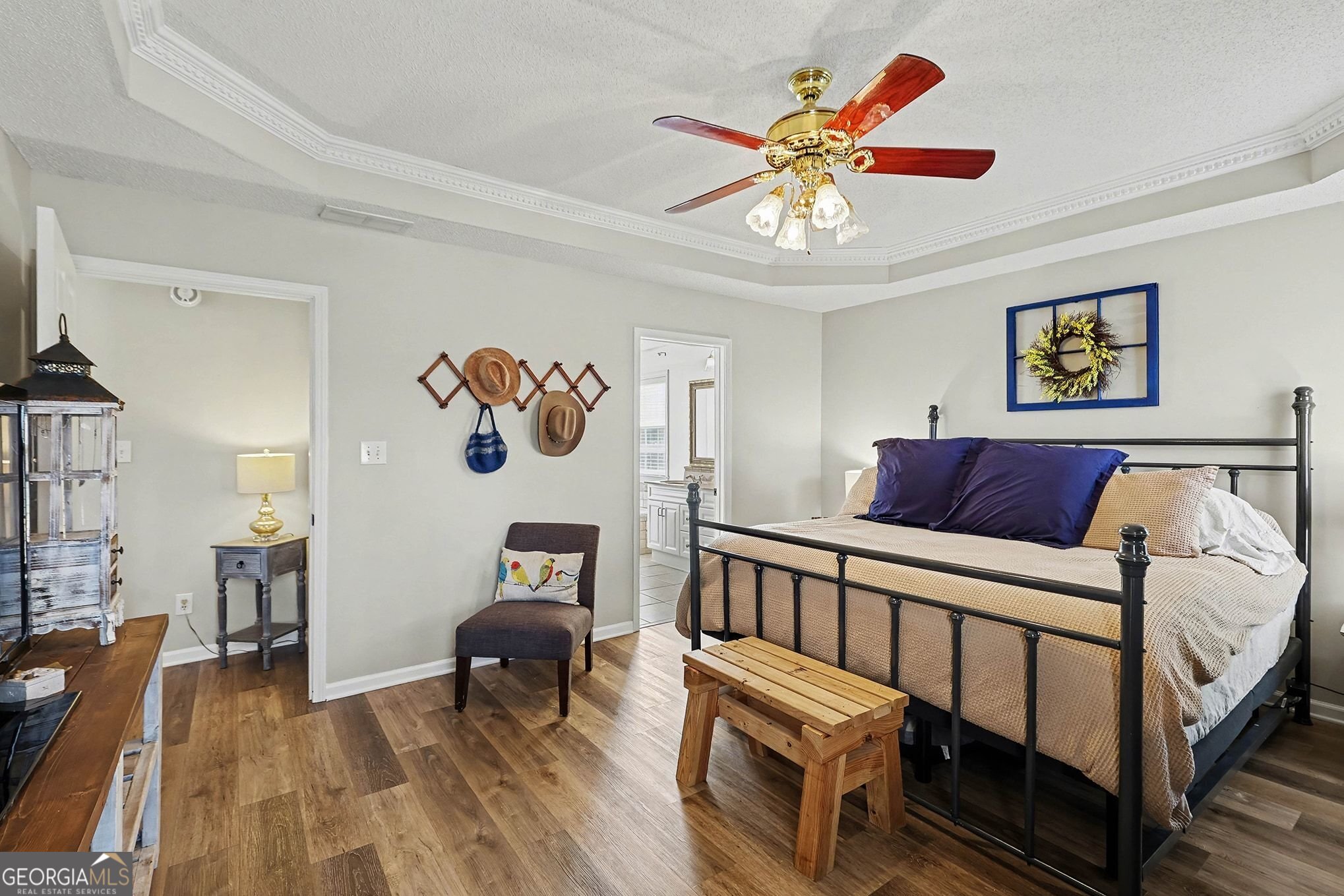 143 Pheasant Ridge Newnan, GA 30265 - Photo 16 of 27 a bedroom with a bed and a chandelier