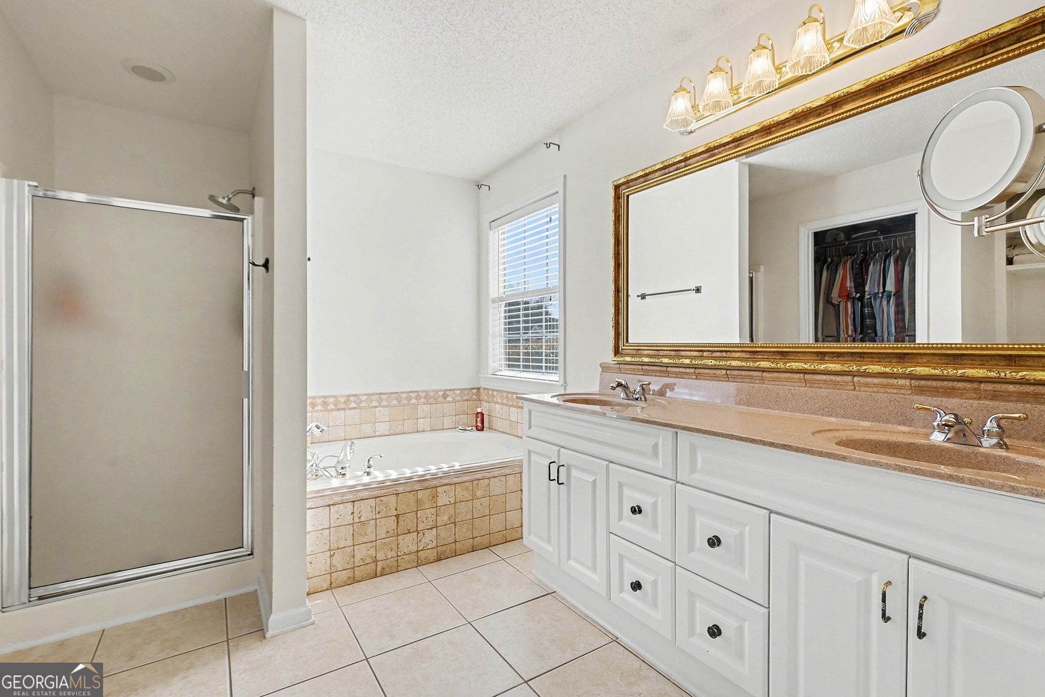 143 Pheasant Ridge Newnan, GA 30265 - Photo 17 of 27 a bathroom with a granite countertop double vanity sink a mirror and a bathtub