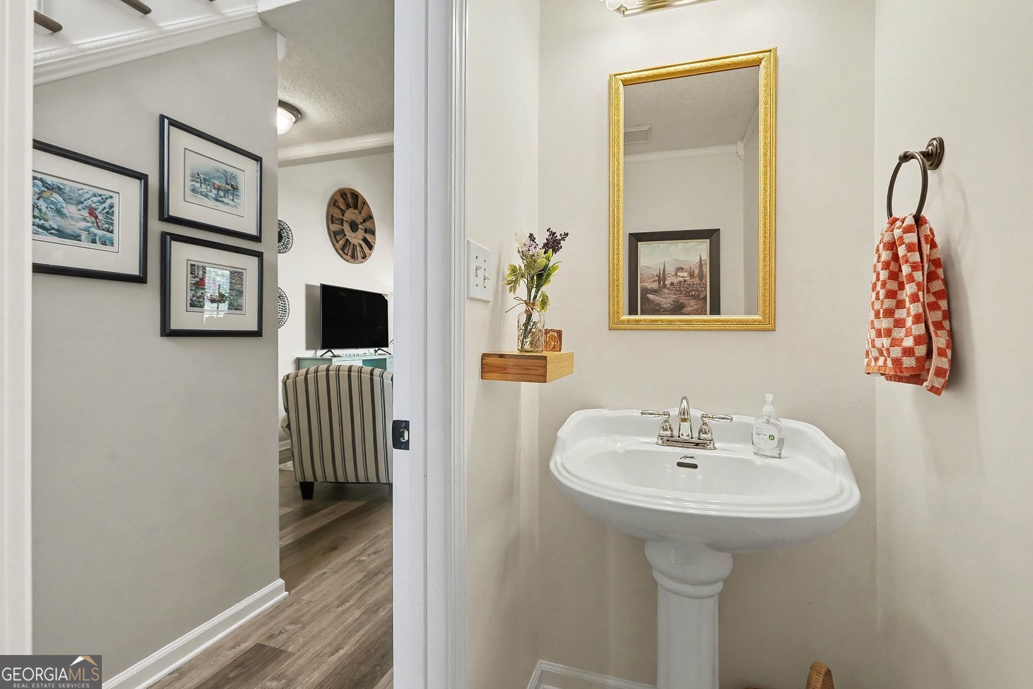 143 Pheasant Ridge Newnan, GA 30265 - Photo 19 of 27 a bathroom with a sink and a mirror