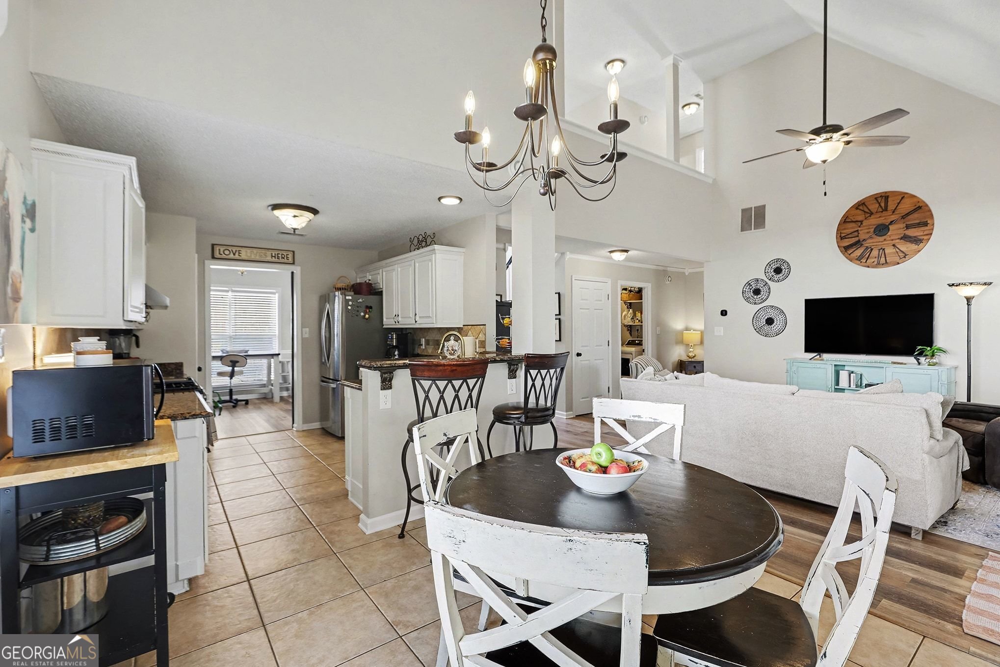 143 Pheasant Ridge Newnan, GA 30265 - Photo 9 of 27 a view of a dining room with furniture and a chandelier
