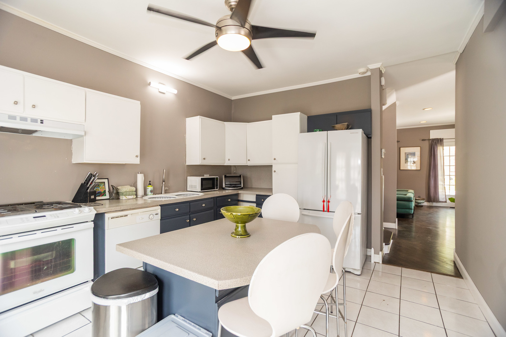 1663 West Farwell Avenue Chicago, IL 60626 - Photo 11 of 29 a kitchen with a stove and white cabinets