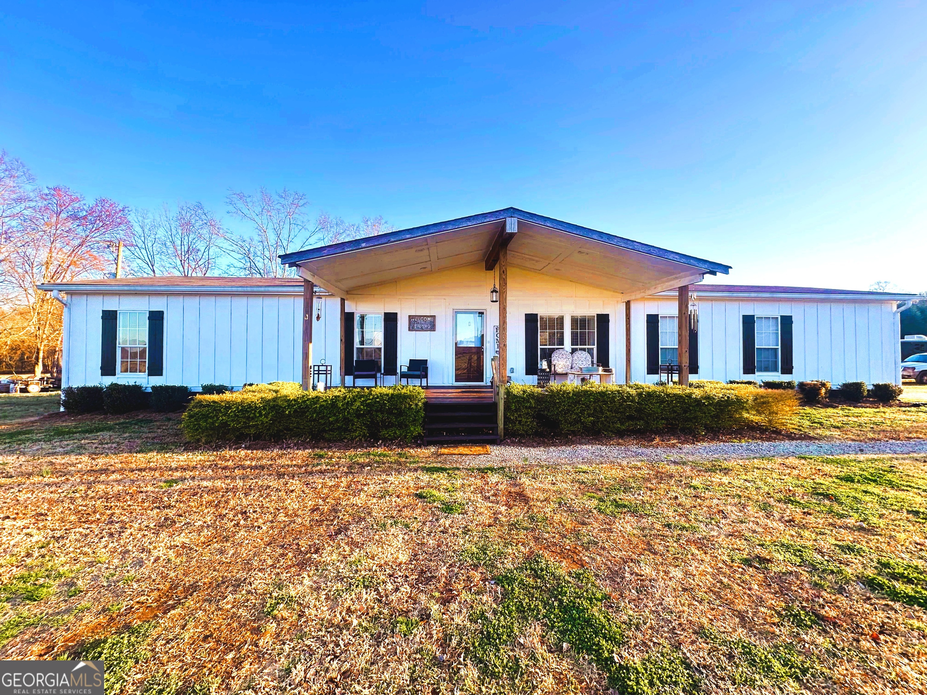 1391 Blue Springs Road Buckhead, GA 30625 - Photo 1 of 36 a front view of a house with a yard