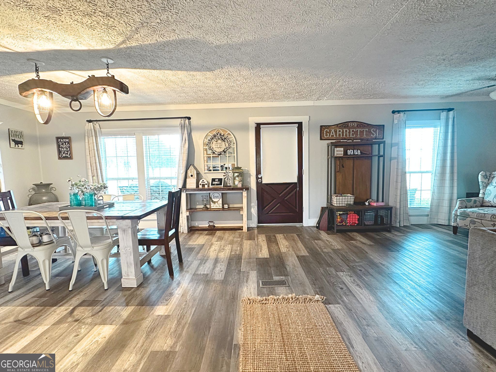 1391 Blue Springs Road Buckhead, GA 30625 - Photo 11 of 36 a view of a dining room with furniture window and wooden floor