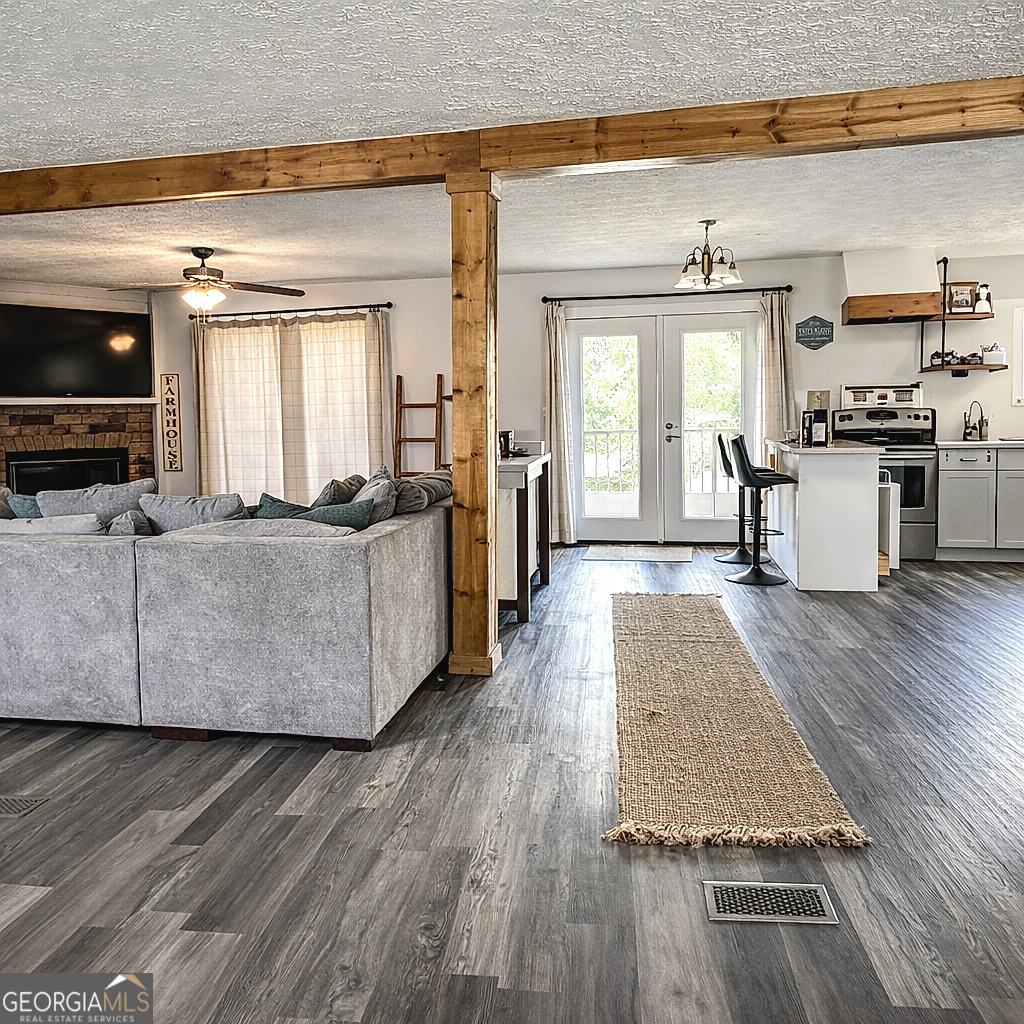 1391 Blue Springs Road Buckhead, GA 30625 - Photo 12 of 36 a living room with furniture and flat screen tv