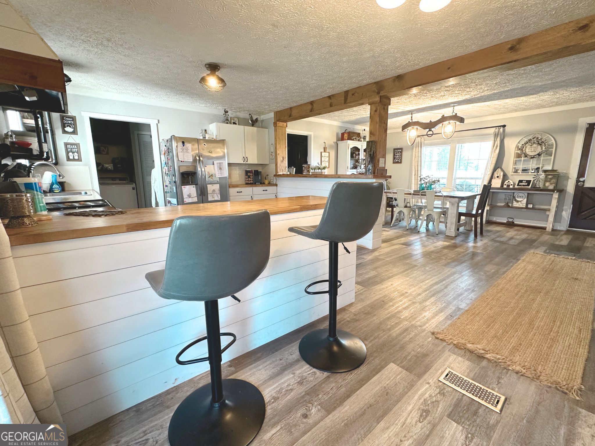 1391 Blue Springs Road Buckhead, GA 30625 - Photo 13 of 36 a view of a living room with furniture and a chandelier