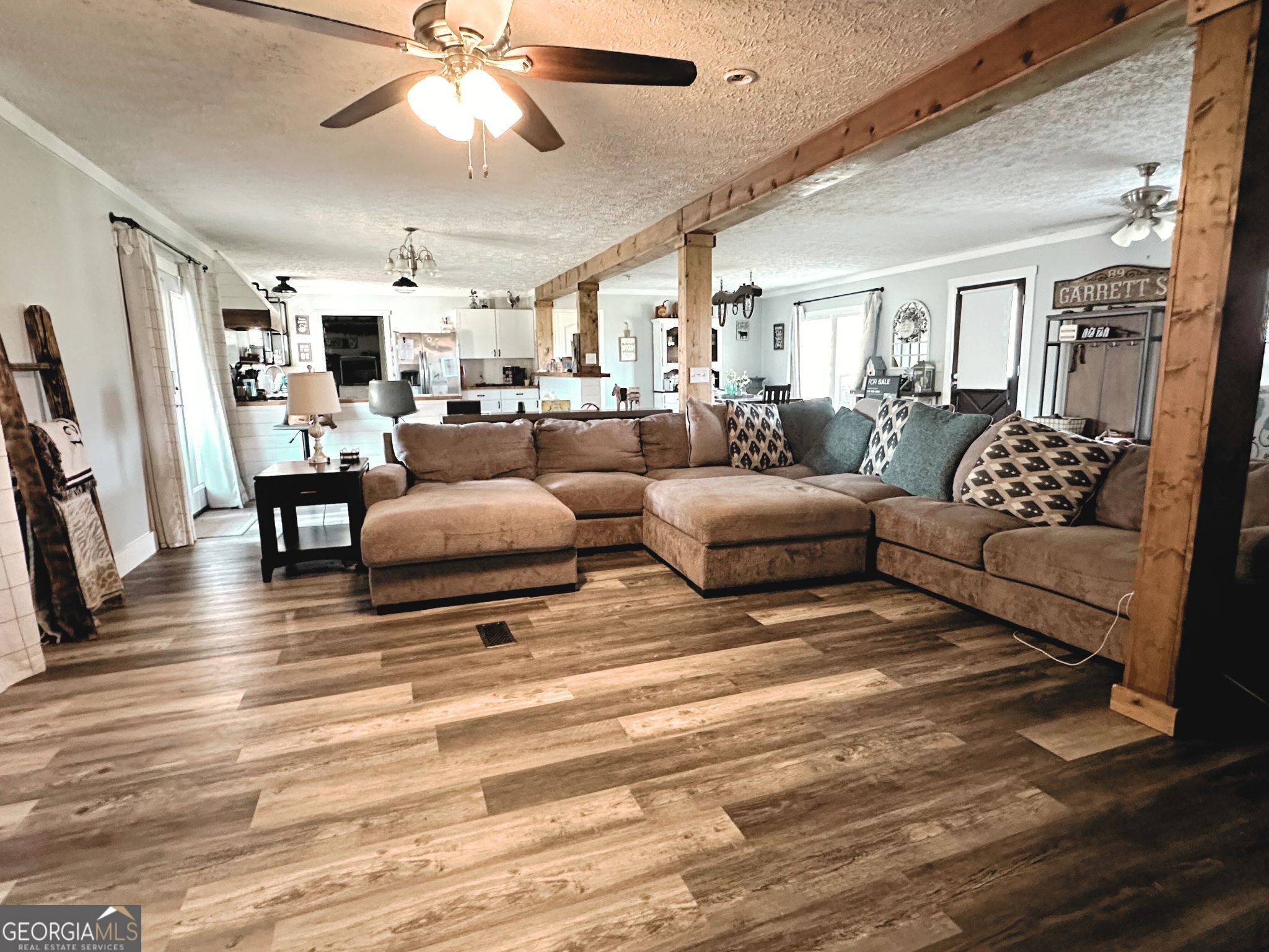 1391 Blue Springs Road Buckhead, GA 30625 - Photo 20 of 36 a living room with furniture and a wooden floor