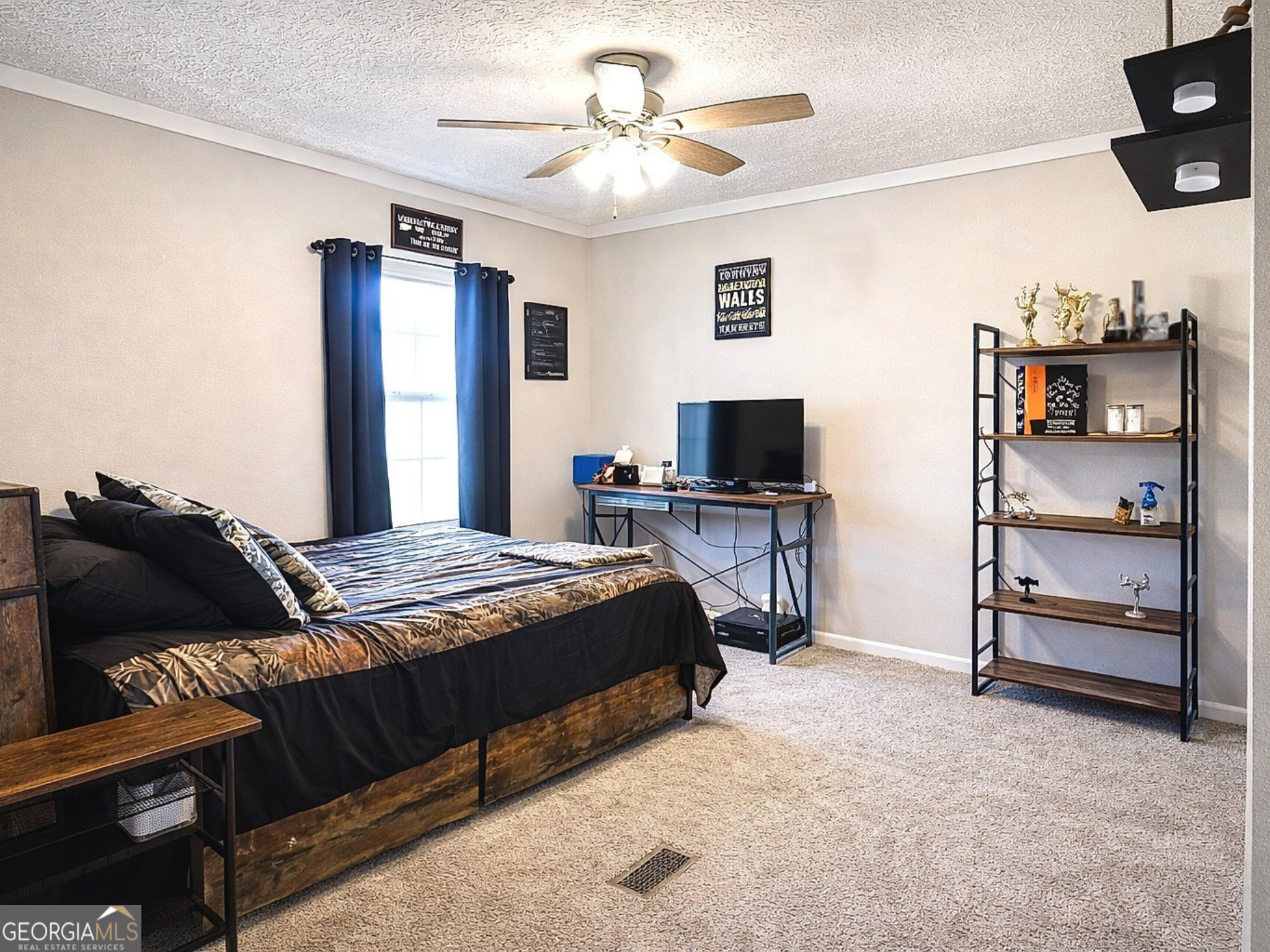 1391 Blue Springs Road Buckhead, GA 30625 - Photo 23 of 36 a bedroom with a bed and a television