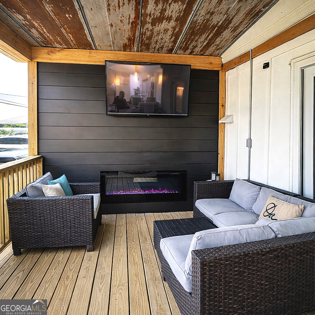 1391 Blue Springs Road Buckhead, GA 30625 - Photo 3 of 36 a living room with furniture and a fireplace