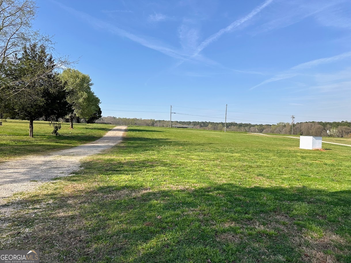 1391 Blue Springs Road Buckhead, GA 30625 - Photo 5 of 36 a view of a water with an outdoor space and seating area