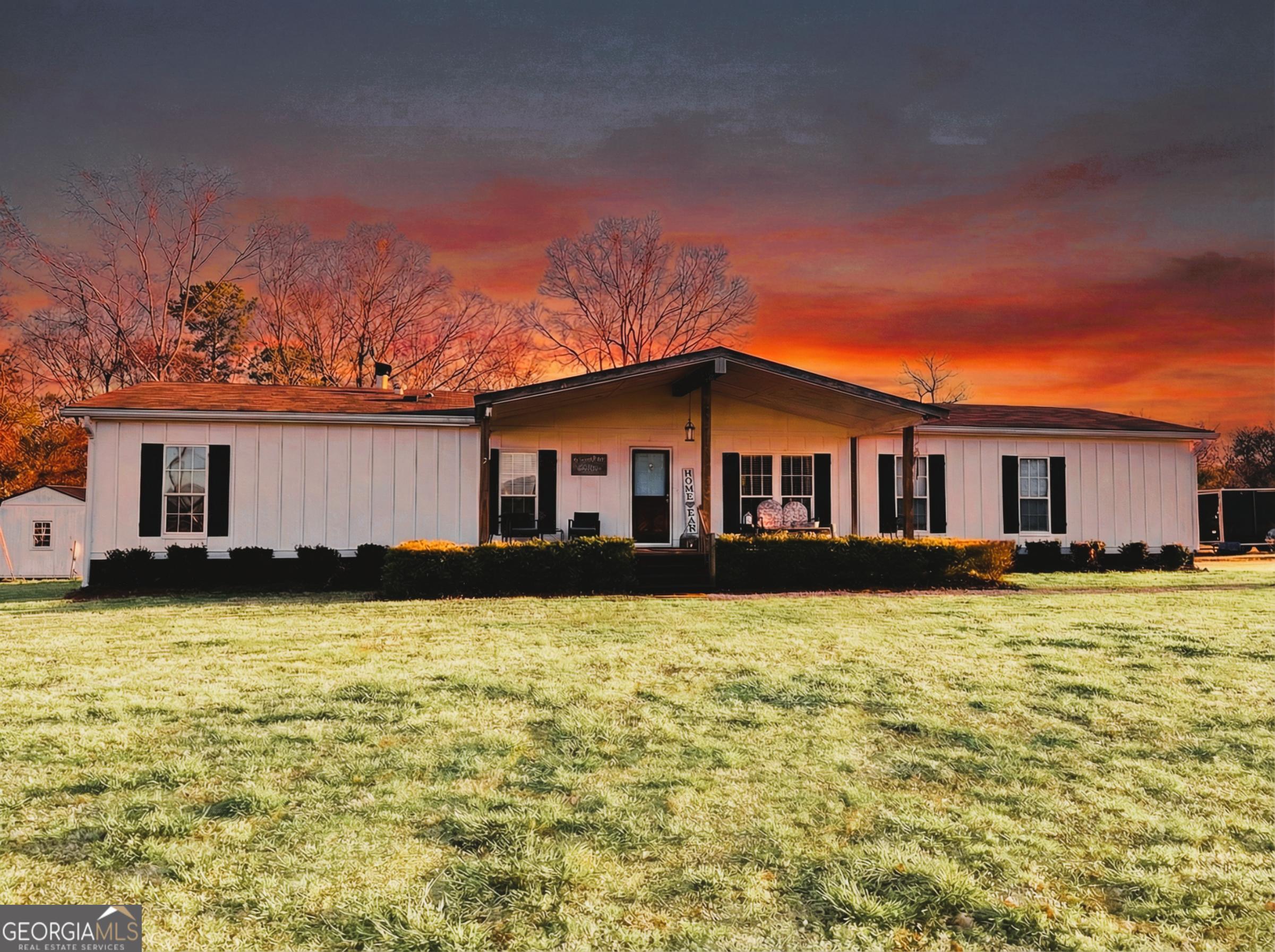 1391 Blue Springs Road Buckhead, GA 30625 - Photo 8 of 36 a front view of a house with yard and balcony