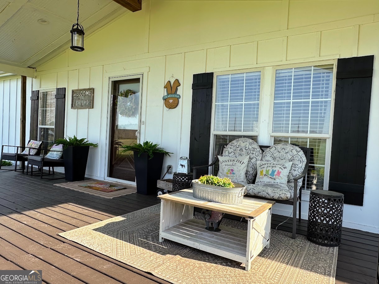 1391 Blue Springs Road Buckhead, GA 30625 - Photo 9 of 36 a living room with furniture and wooden floor