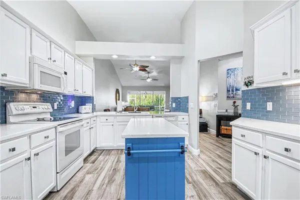 a kitchen with counter top space and appliances