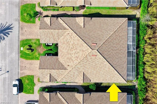 a aerial view of a house with swimming pool and garden