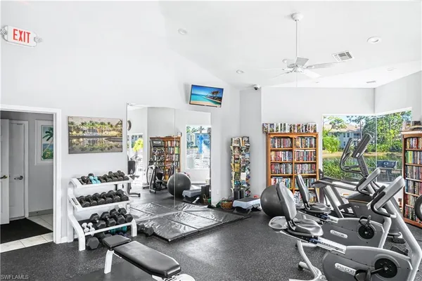 a view of a livingroom with furniture and a floor to ceiling window